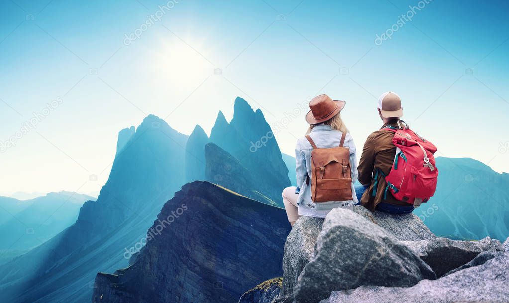 Travelers couple look at the mountains landscape. Travel and active life concept with team. Adventure and travel in the mountains region