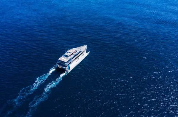 Aerial view of luxury floating cruise ship on transparent turquoise water at sunny day. Summer seascape from air. Top view from drone. Seascape with cruise ship. Travel - image