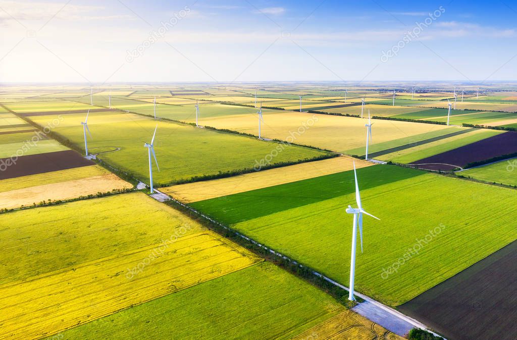 Wind power station on the field. Aerial view from drone. Concept and idea of alternative energy development. Technology - image