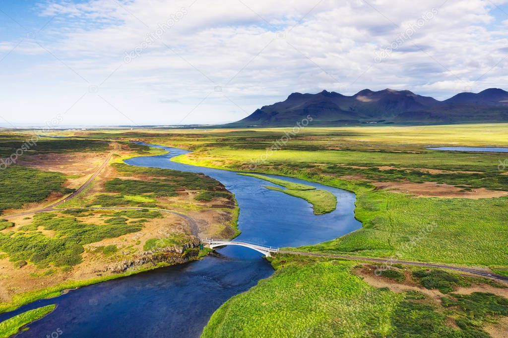 Iceland. Aerial view on the mountain, field, bridge and river. Landscape in the Iceland at the day time. Landscape from drone. Travel - image