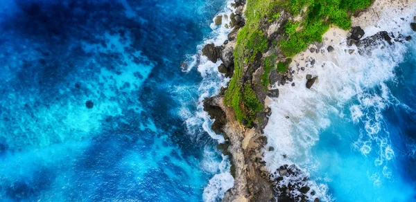 Waves and rocks as a background from top view. Blue water background from top view. Summer seascape from air. Bali island, Indonesia. Travel - image