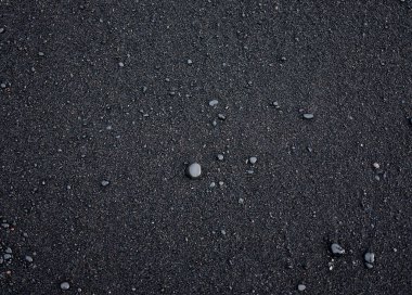 İzlanda 'nın deniz kıyısında bir arka plan olarak siyah kum. Soyut kompozisyon. Tasarım - Resim