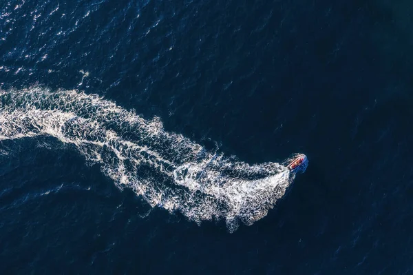 Mediterranean sea. Seascape with scooter. Aerial view of floating scooter on blue sea at sunny day. Top view from drone at beach and azure sea. Travel and relax - image