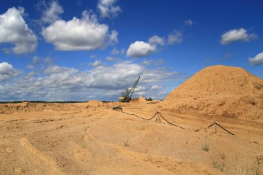 Career bulldozer extracts breed in a quarry