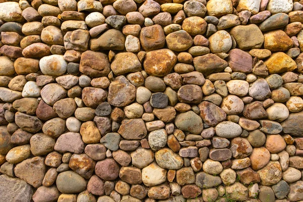Textured stone wall bright multi-colored stones — 스톡 사진