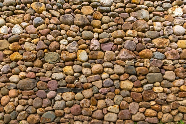 Текстурована кам'яна стіна яскраві різнокольорові камені — стокове фото