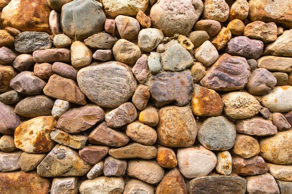 Textured stone wall bright multi-colored stones — Stock Photo, Image