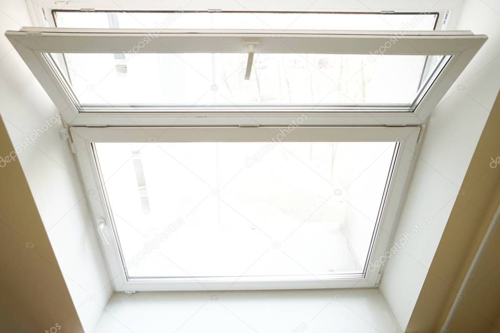 white glass pane open for ventilation on a white background close-up