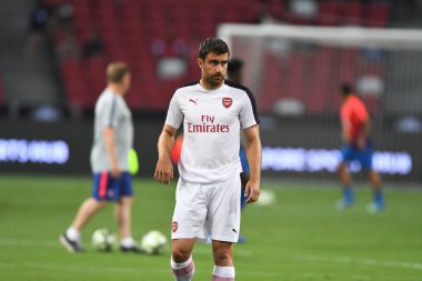 Kallang-Singapur-26Jul2018: Sokratis Papastathopoulos # 5 cephanelik oyuncusunun icc2018 'de atletico de Madrid' deki ulusal stadyumda atletico de Madrid 'e karşı oynadığı maçta