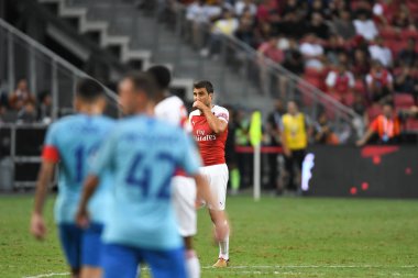 Kallang-Singapur-26Jul2018: Sokratis Papastathopoulos # 5 cephanelik oyuncusunun icc2018 'de atletico de Madrid' deki ulusal stadyumda atletico de Madrid 'e karşı oynadığı maçta