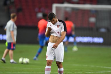 Kallang-Singapur-26Jul2018: Sokratis Papastathopoulos # 5 cephanelik oyuncusunun icc2018 'de atletico de Madrid' deki ulusal stadyumda atletico de Madrid 'e karşı oynadığı maçta