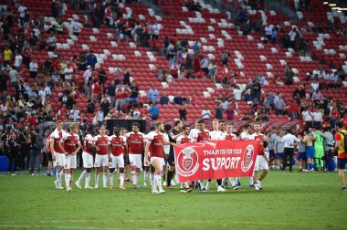Kallang-Singapore-26Jul2018:Player of arsenal walk for appreciate fan after icc2018 between arsenal against at atletico de madrid at national stadium,singapore clipart
