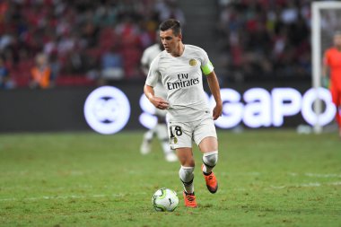 Kallang-Singapur-28Jul2018: Giovani LO Celso # 18 PSG oyuncusu icc2018 'de Paris Saint-Alman Ulusal Stadyumu, Singapur' daki cephaneliğe karşı savaşıyor.