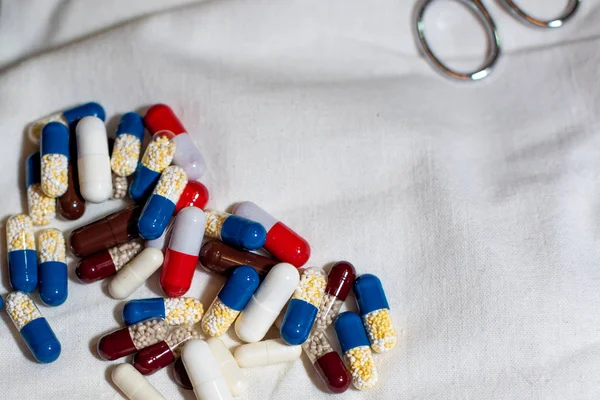 Colorful capsules. Pills and tablets on white background.