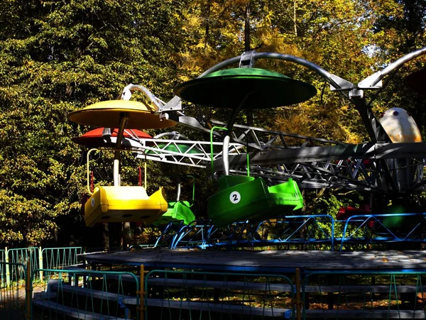 Carousel in an oak park in autumn — Stock Photo, Image