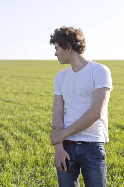 Boy Teenager Walking Field Covered Green Shoots Wheat — Stock Photo, Image