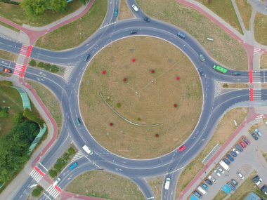 Roundabout intersection in five directions with island, aerial view. clipart