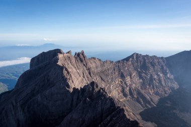 A view from 'Puncak Sejati' (3,344m) and its Caldera. Raung is the most challenging of all Java’s mountain trails, also is one of the most active volcanoes on the island of Java in Indonesia. clipart