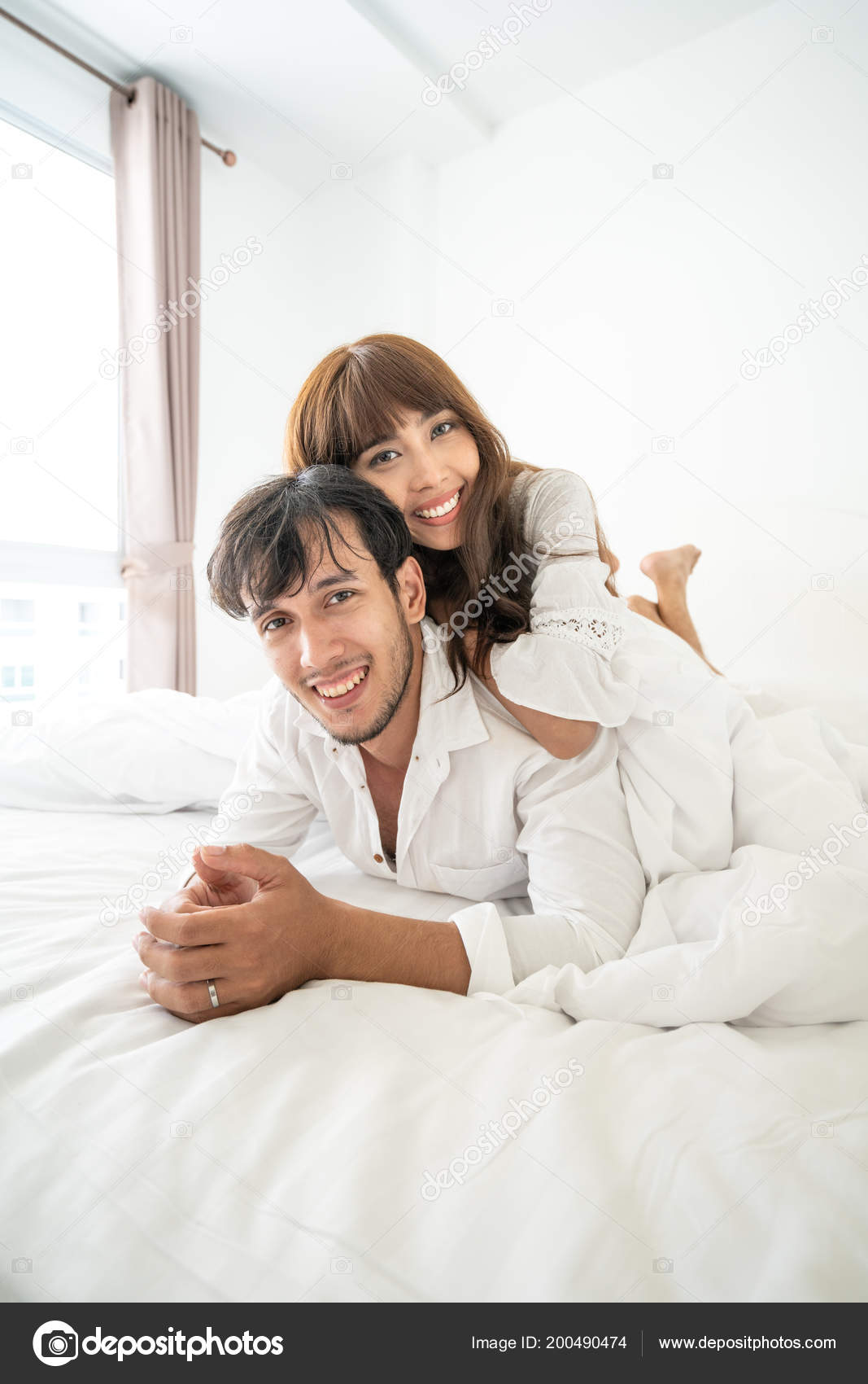 Young Couple Bedroom Hugging Lying Bed Stock Photo