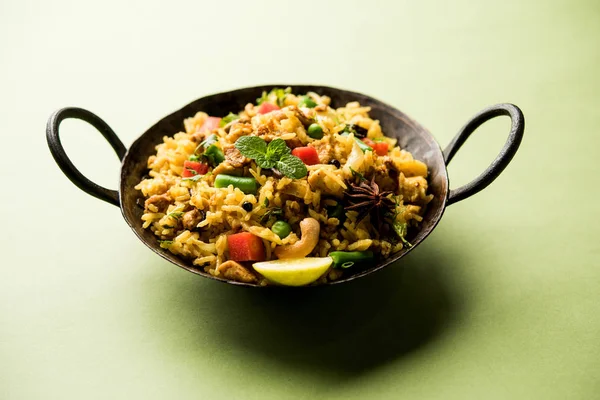 Kheema Pulao - Rice cooked with mutton or chicken mince with vegetables and spices. served in a bowl. selective focus