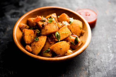 Masala Idlies - Domates ketçap ile artık ile tembel tembel kullanılarak yapılan Hindistan aperatif servis Güney kızarmış. seçici odak