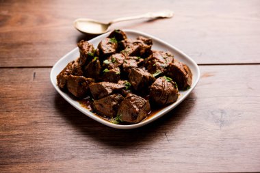 Koyun karaciğer fry veya Kaleji masala, Hindistan ve Pakistan popüler Sigara Vejetaryen yemek tarifi. Kuru veya bir kase, karahi veya plaka köri ile servis