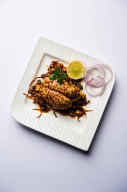 Beyin / Bheja Fry, keçi, koyun veya kuzu Bakra Eid(Eid-ul-zuha) üzerinde pişmiş popüler bir Hintli ya da Pakistanlı çanak. karahi, tava veya plaka servis. seçici odak