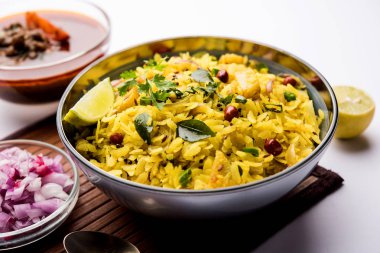 Aloo/Kanda Poha or Tarri Pohe with spicy chana masala/curry. selective focus clipart