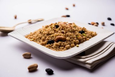 Sweet Sheera / Halwa / Sooji made using semolina or rawa, popular dessert recipe made using Indian Festivals. Served in a bowl or plate. selective focus clipart