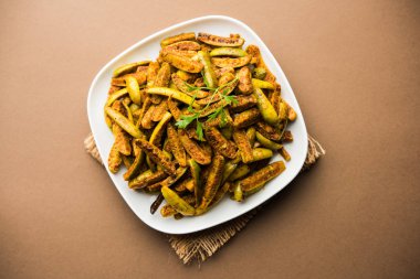 Tindora Sabzi / Tendli / tondli Fry olarak da bilinen Ivy Gourd kızartma tarifi. seçici odak