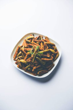 Tindora Sabzi / Tendli / tondli Fry olarak da bilinen Ivy Gourd kızartma tarifi. seçici odak