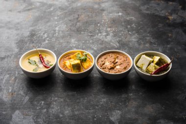 Palak paneer tereyağı masala, sarı dal veya dal-makhani bir grup bir kase servis edilir. seçici odaklama