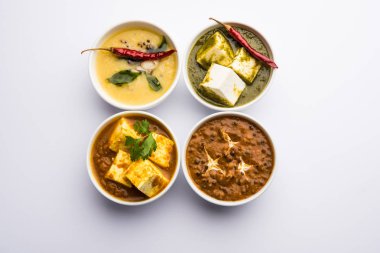 Palak paneer tereyağı masala, sarı dal veya dal-makhani bir grup bir kase servis edilir. seçici odaklama