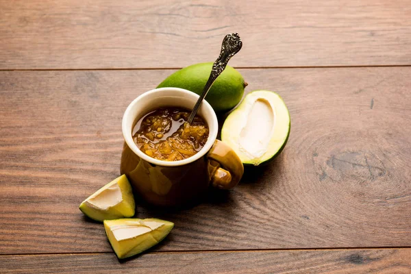 Mango Chunda or Sakhar Amba is a traditional indian summer recipe made using accha aam preserved in sugar syrup for days. selective focus