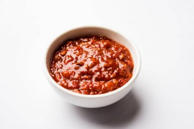 Schezwan Sauce / Szechuan chutney is an important ingredient in Chinese recipe. served in a bowl, isolated.  selective focus clipart