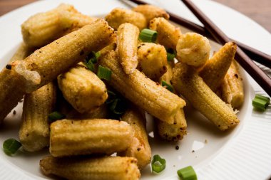 Bebek Mısır Mançurya kuru - popüler Hindi-çin başlangıç tarifi. seçici odaklama