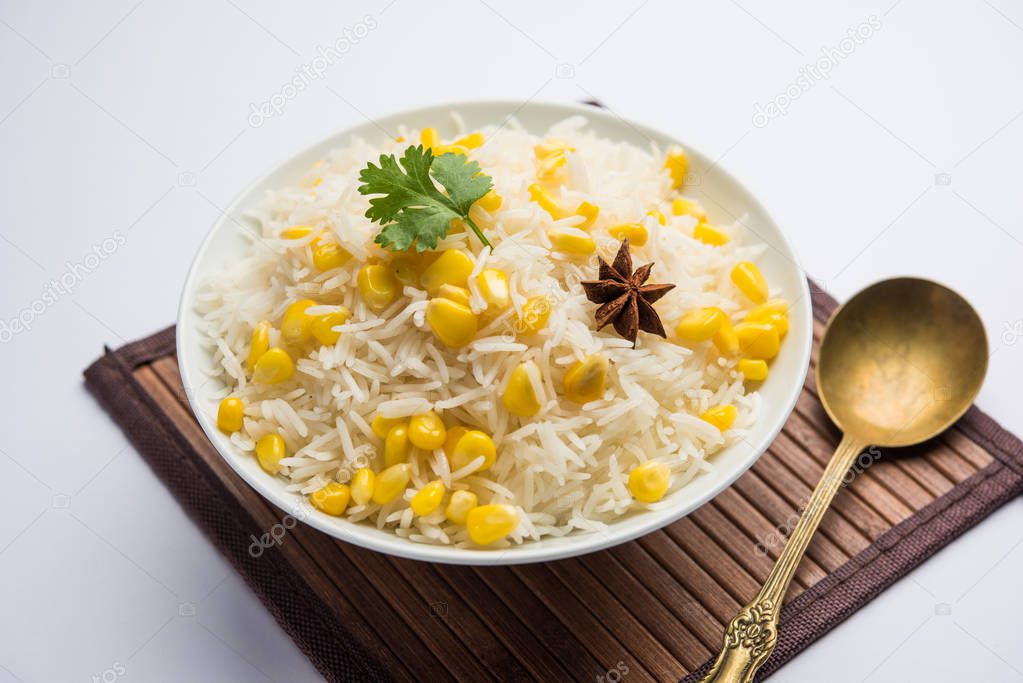 Corn Rice made using boiled Maize seeds with basmati rice, served in a bowl. selective focus 