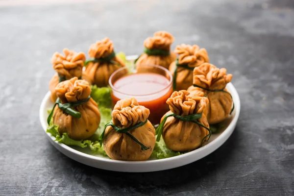 Crispy Potli Samosa or veg money bags are delicious Indian snacks of spiced aloo and mix veggies Or Meat/kheema  stuffed in flaky dough. It's a great creative starter or appetiser. served with ketchup