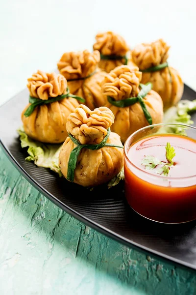 Crispy Potli Samosa or veg money bags are delicious Indian snacks of spiced aloo and mix veggies Or Meat/kheema  stuffed in flaky dough. It\'s a great creative starter or appetiser. served with ketchup
