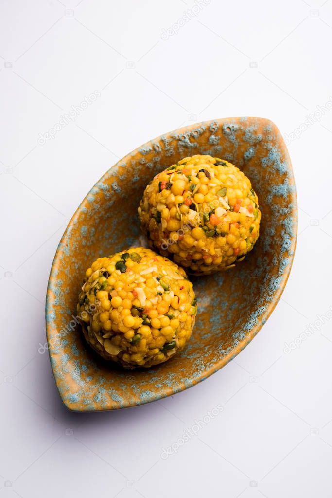 Jumbo Boondi Laddu mixed with dry fruits also know as laddoo/ ladoo/ laddo or Sweet dumplings made during festivals or weddings