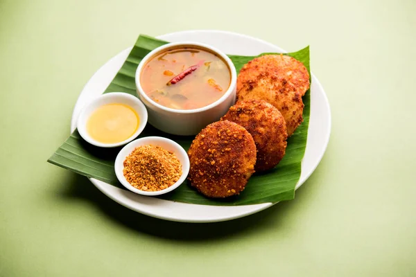 Podi idli is a quick and easy snack made with leftover idly. served with sambar and coconut chutney. selective focus