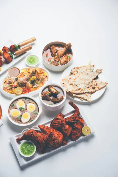 Assorted Indian Non Vegetarian food recipe served in a group. Includes Chicken Curry, Mutton Masala, Anda/egg curry, Butter chicken, biryani, tandoori murg, chicken-tikka and naan/roti