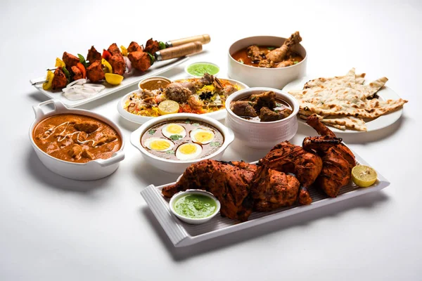 Assorted Indian Non Vegetarian food recipe served in a group. Includes Chicken Curry, Mutton Masala, Anda/egg curry, Butter chicken, biryani, tandoori murg, chicken-tikka and naan/roti