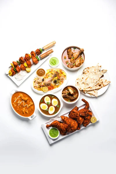 Assorted Indian Non Vegetarian food recipe served in a group. Includes Chicken Curry, Mutton Masala, Anda/egg curry, Butter chicken, biryani, tandoori murg, chicken-tikka and naan/roti