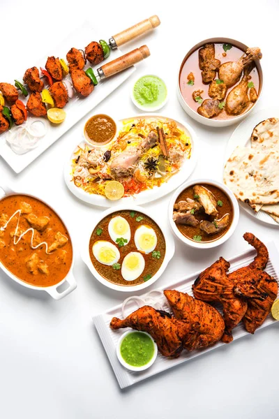 Assorted Indian Non Vegetarian food recipe served in a group. Includes Chicken Curry, Mutton Masala, Anda/egg curry, Butter chicken, biryani, tandoori murg, chicken-tikka and naan/roti