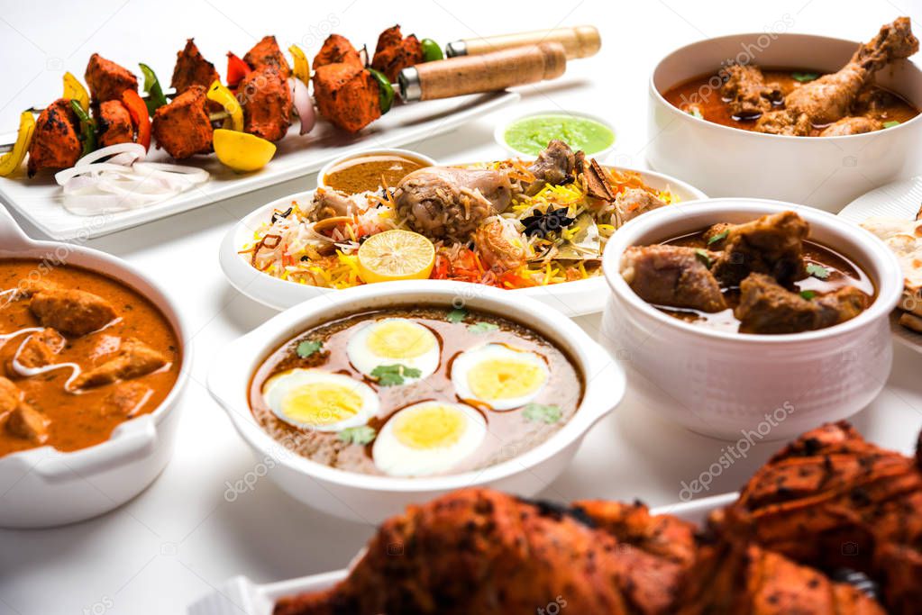 Assorted Indian Non Vegetarian food recipe served in a group. Includes Chicken Curry, Mutton Masala, Anda/egg curry, Butter chicken, biryani, tandoori murg, chicken-tikka and naan/roti