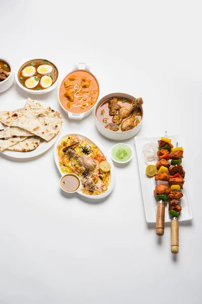 Assorted Indian Non Vegetarian food recipe served in a group. Includes Chicken Curry, Mutton Masala, Anda/egg curry, Butter chicken, biryani, tandoori murg, chicken-tikka and naan/roti