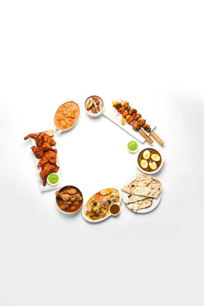 Assorted Indian Non Vegetarian food recipe served in a group. Includes Chicken Curry, Mutton Masala, Anda/egg curry, Butter chicken, biryani, tandoori murg, chicken-tikka and naan/roti