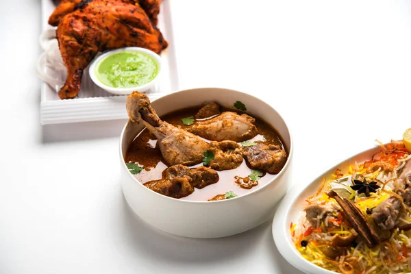 Assorted Indian Non Vegetarian food recipe served in a group. Includes Chicken Curry, Mutton Masala, Anda/egg curry, Butter chicken, biryani, tandoori murg, chicken-tikka and naan/roti