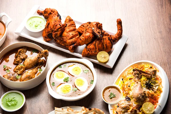 Assorted Indian Non Vegetarian food recipe served in a group. Includes Chicken Curry, Mutton Masala, Anda/egg curry, Butter chicken, biryani, tandoori murg, chicken-tikka and naan/roti